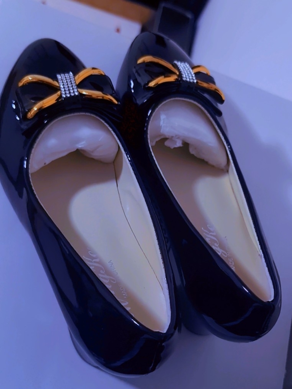 Patent Black Ballet Flats with Gold Bow Accent